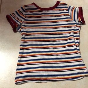 A colorful stripped kid shirt